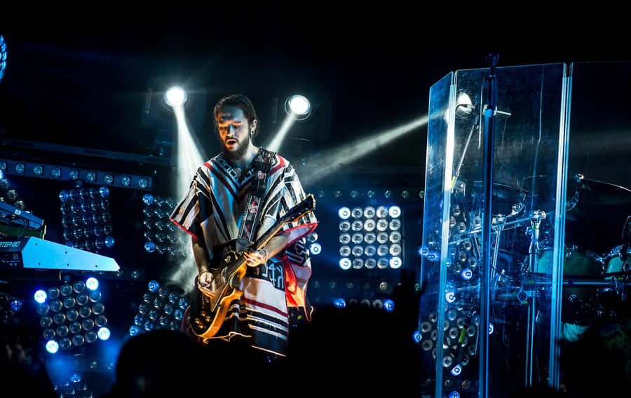 Guitarist Performing Live Concert Wallpaper