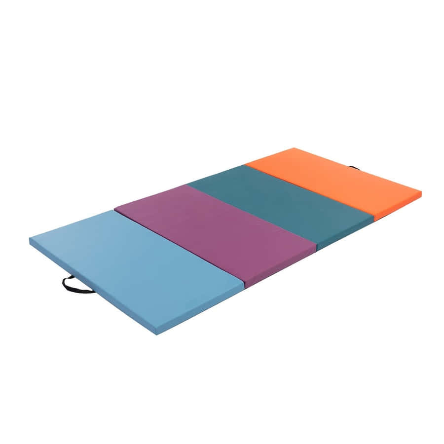 Gymnast Training On A Brightly-colored Gymnastics Mat Wallpaper