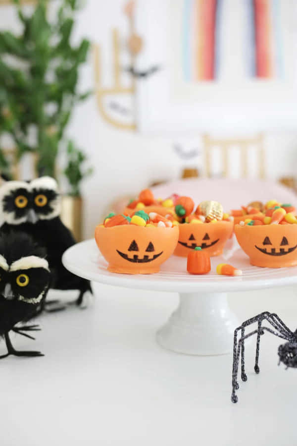 Halloween Candy Bowlswith Decorations Wallpaper