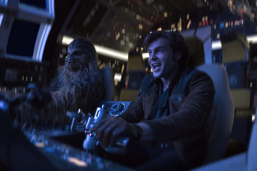 Han Solo And Chewbacca In Action Wallpaper