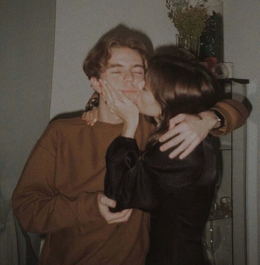 Happy Couple Enjoying A Cozy Embrace Wallpaper