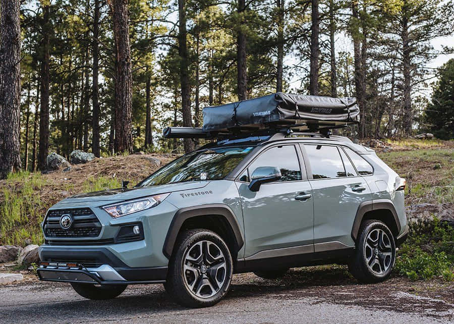 Happy Family Enjoying A Road Trip In Their Spacious Car Wallpaper