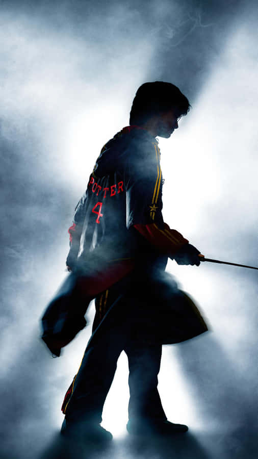 Harry Potter Clutching The Goblet Of Fire In A Climactic Moment Wallpaper