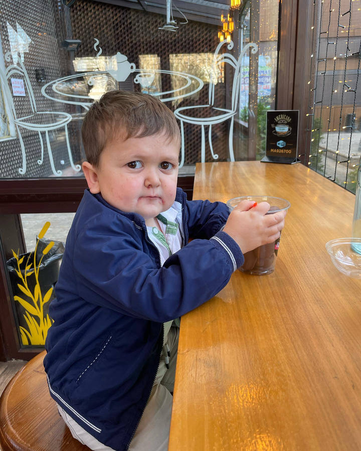 Hasbulla Holding A Refreshing Drink Wallpaper