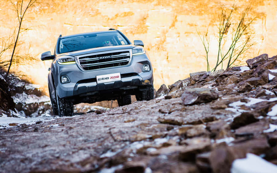 Haval Suv Gliding Across A Scenic Landscape Wallpaper