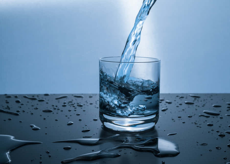 Have A Glass Of Water During The Day To Stay Hydrated. Wallpaper