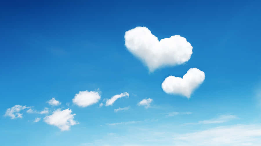 Heart Shaped Clouds In Blue Sky Wallpaper