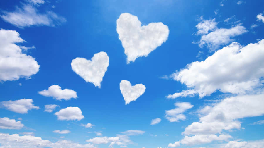 Heart Shaped Clouds In Sky Wallpaper
