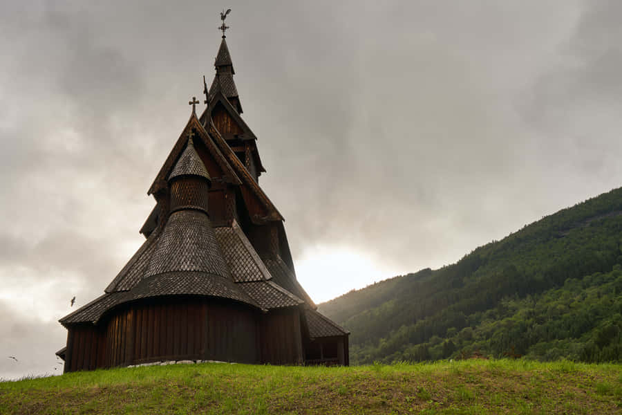 Heddal Stave Church With Peeking Sun Wallpaper
