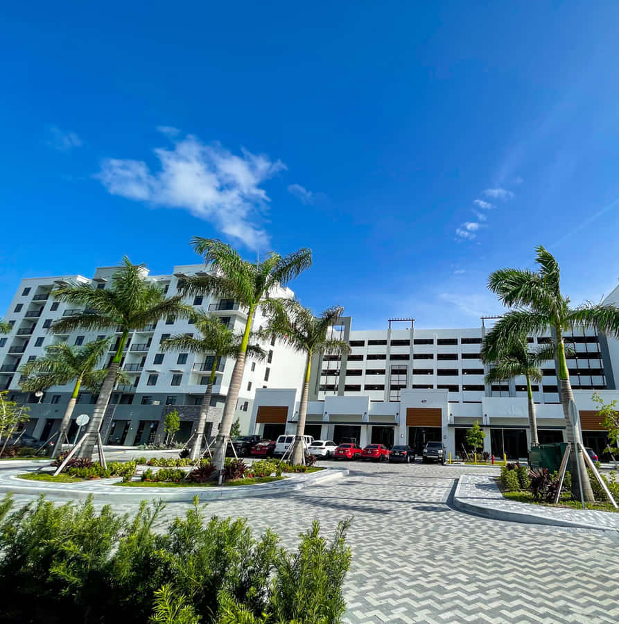 Hialeah Modern Apartment Complex Under Blue Sky Wallpaper