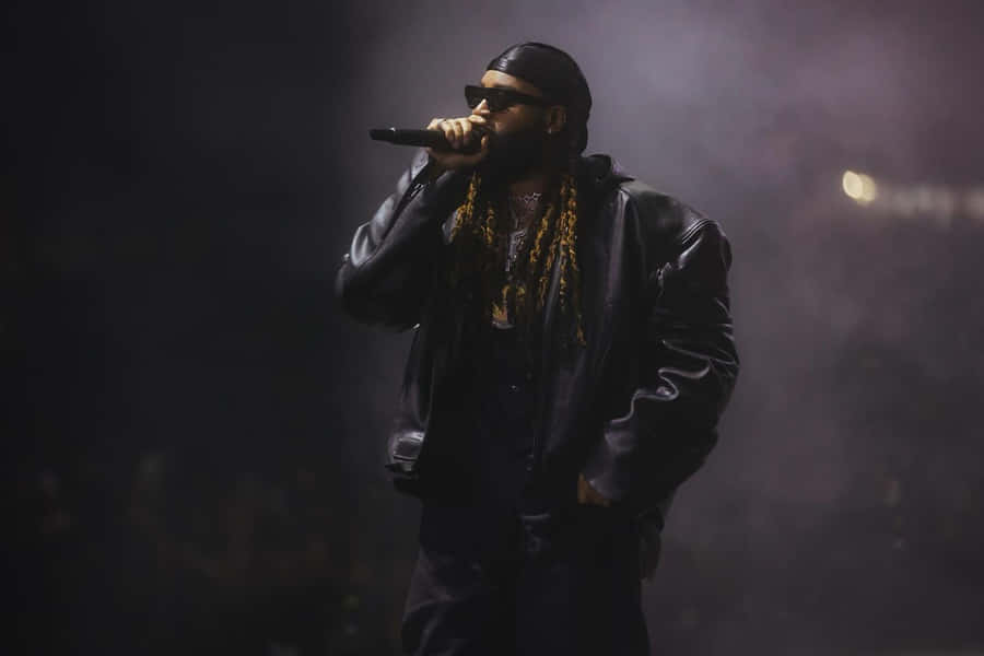 Hip Hop_ Artist_ Performing_on_ Stage.jpg Wallpaper