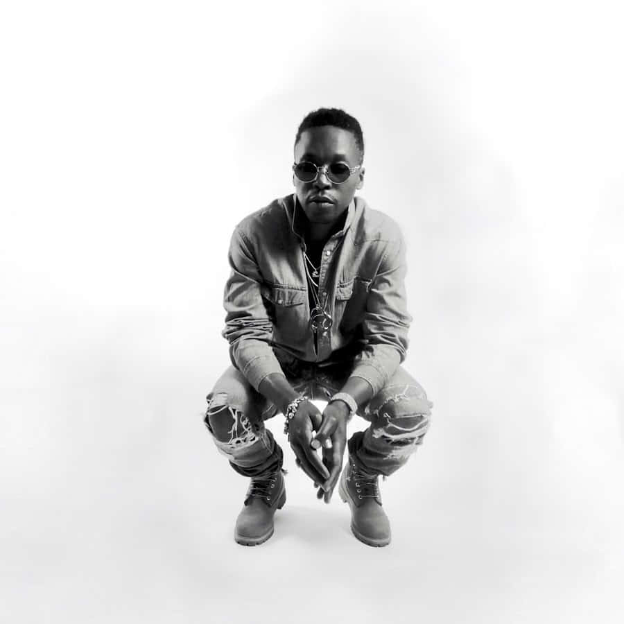 Hip Hop Artist Squatting Pose Wallpaper