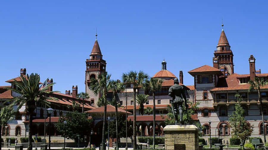 Historic_ College_ Building_with_ Statue Wallpaper