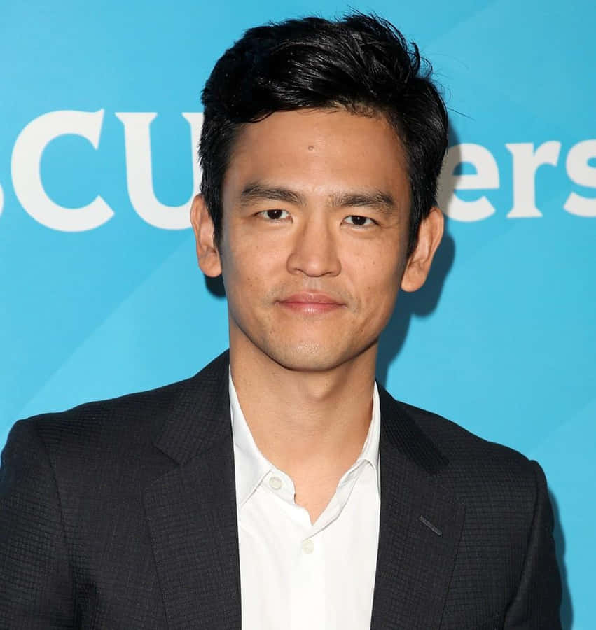 Hollywood Actor John Cho Posing For A Portrait Wallpaper