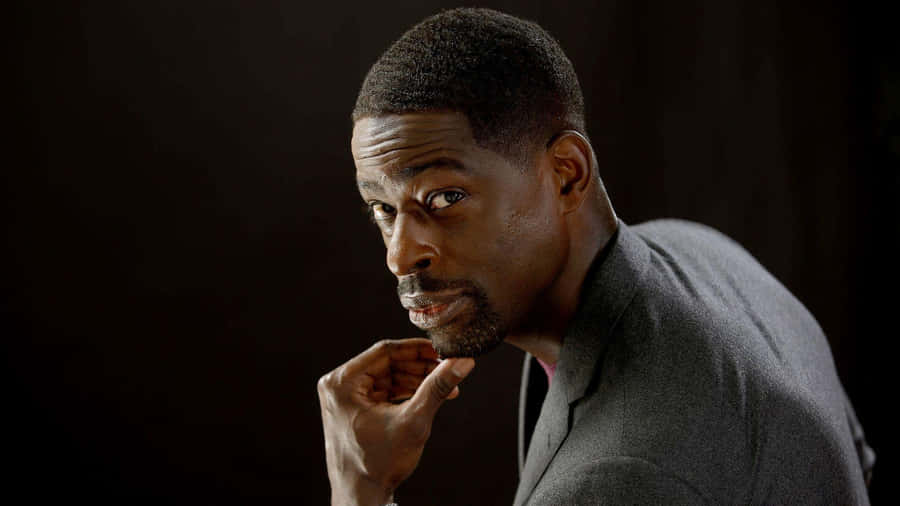 Hollywood Actor Sterling K Brown In A Reflective Pose Wallpaper