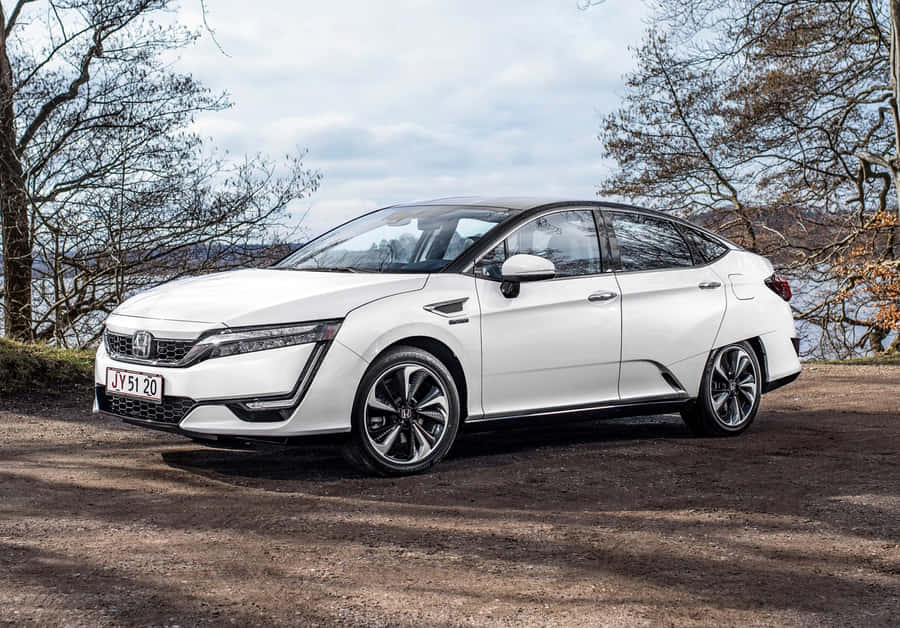 Honda Clarity Electric Sedan Parked On A City Street Wallpaper