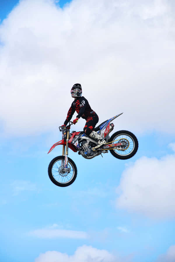 Honda Dirt Bike Posing Clear Skies Wallpaper