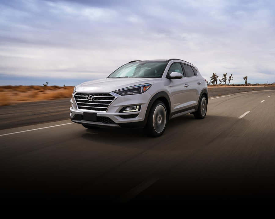 Hyundai Tucson In A Striking Urban Landscape Wallpaper