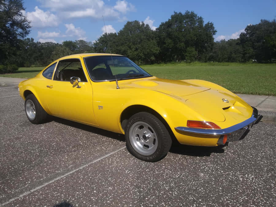 Iconic Opel Gt On The Highway Wallpaper