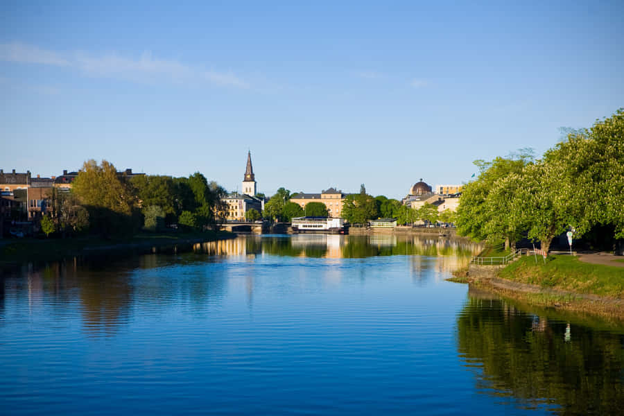 Iconic Riverside Scenery Of Karlstad, Sweden Wallpaper