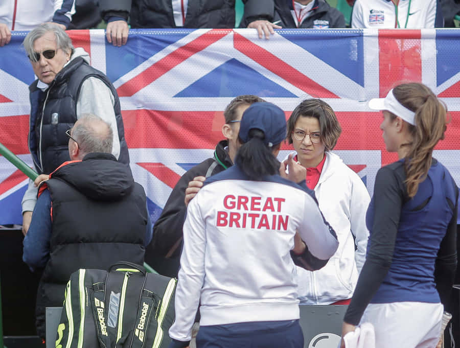 Iconic Tennis Legend Ilie Năstase In Action Wallpaper