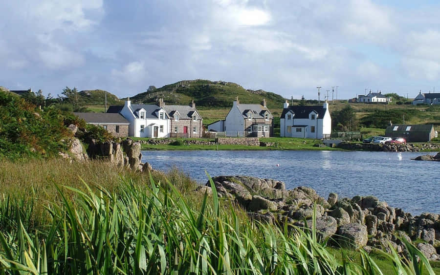 Idyllic Coastal Village: A Serene Capture Wallpaper