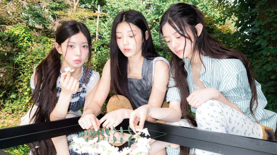 Illit Members Enjoy Outdoor Activity Wallpaper