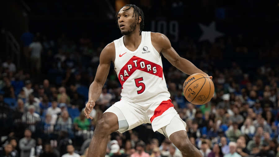 Immanuel Quickley Playing Basketball Wallpaper