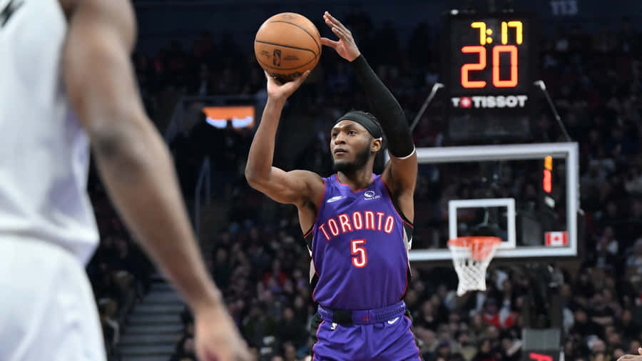 Immanuel Quickley Shooting Over Defender Wallpaper