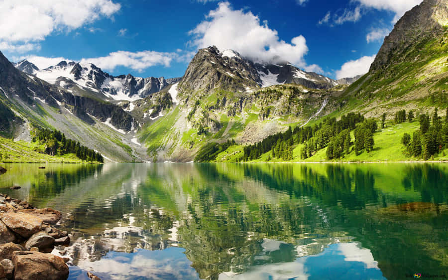 Immerse Yourself In Nature At This Beautiful Mountain Lake Wallpaper