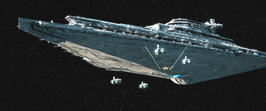 Imperial Star Destroyer From Star Wars Looms In Space Wallpaper