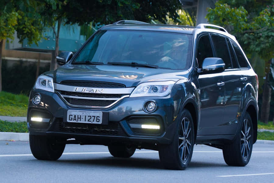 Impressive Lifan Motorcycle On A Scenic Road Wallpaper