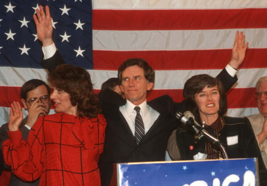 Influential Politician Gary Hart Waving To Crowd Wallpaper