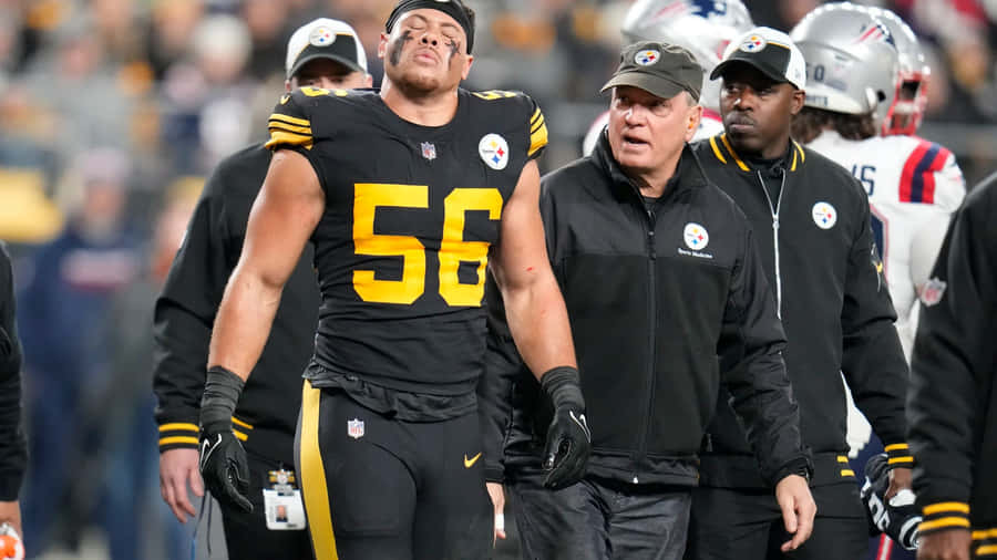 Injured Player Alex Highsmith Leaving Field Wallpaper