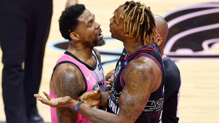 Intense Basketball Court Confrontation Wallpaper