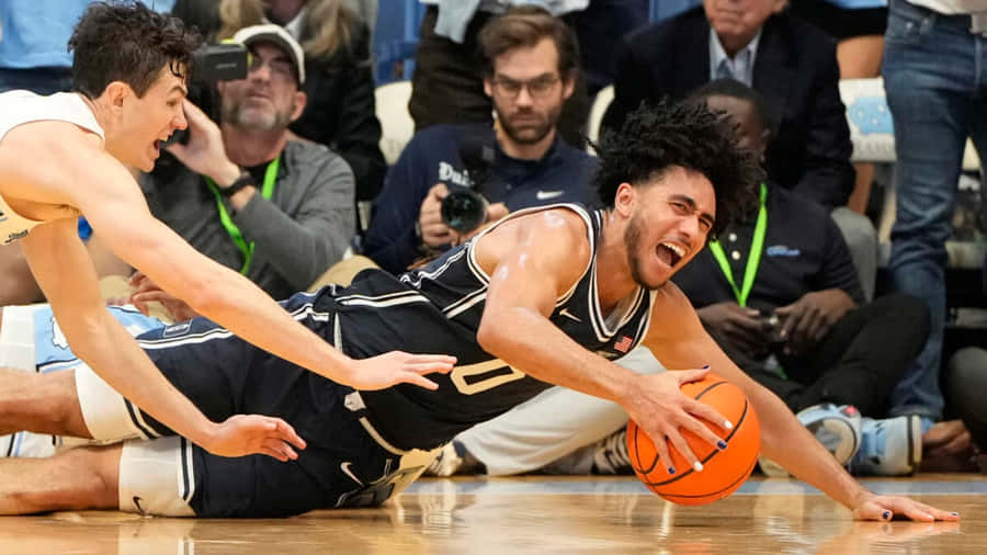 Intense Basketball Game Dive Wallpaper