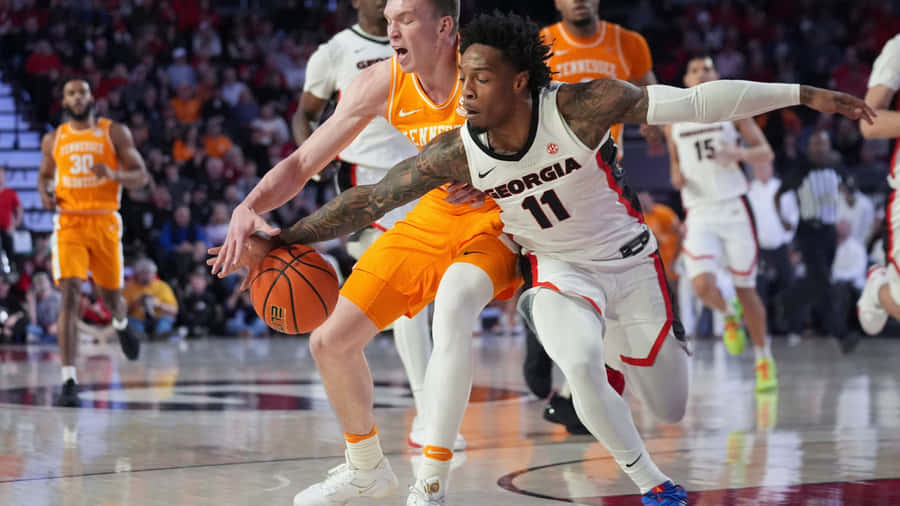 Intense College Basketball Matchup Wallpaper