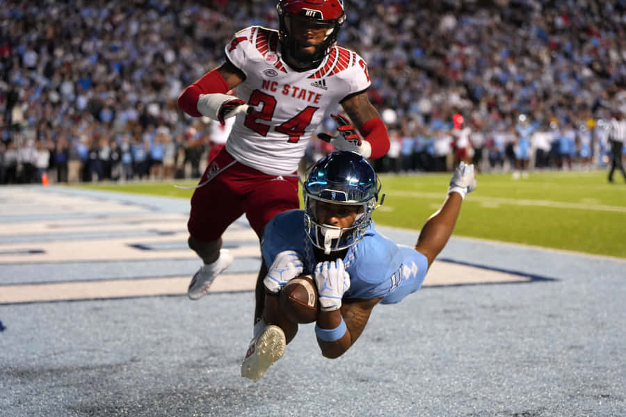 Intense College Football Matchup Wallpaper