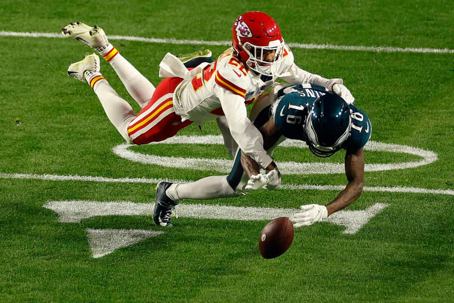 Intense Football Actiononthe Field Wallpaper