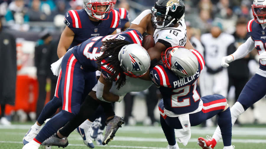 Intense Football Defense Tackle Wallpaper