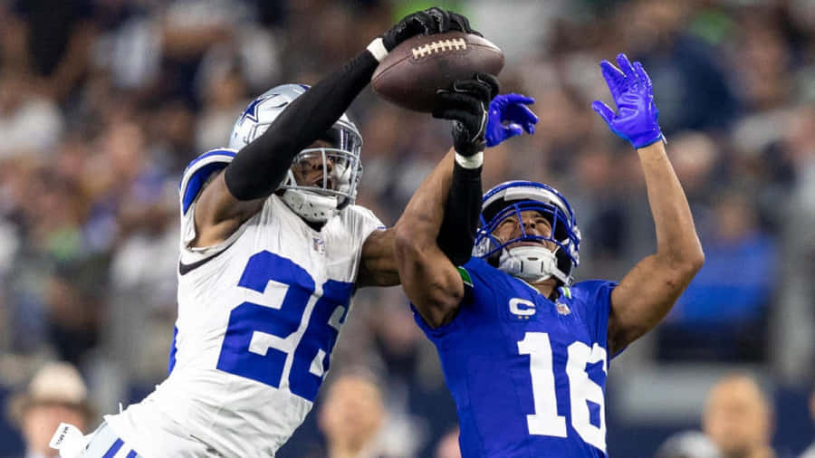 Intense Football Match Defensive Play Wallpaper