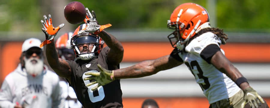 Intense Football Practice Catch Wallpaper