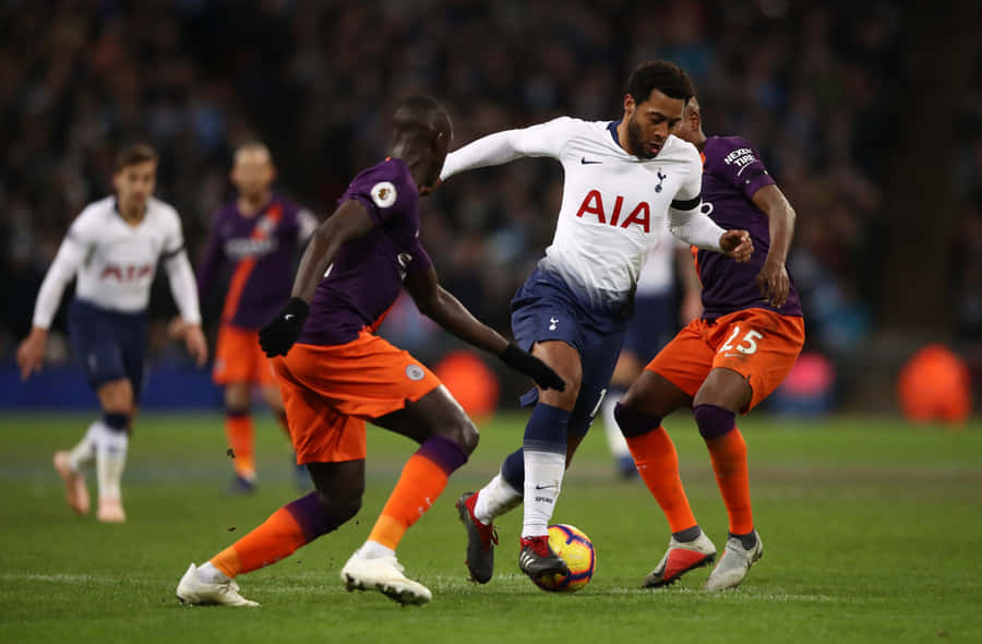 Intense Midfield Duel Soccer Match Wallpaper