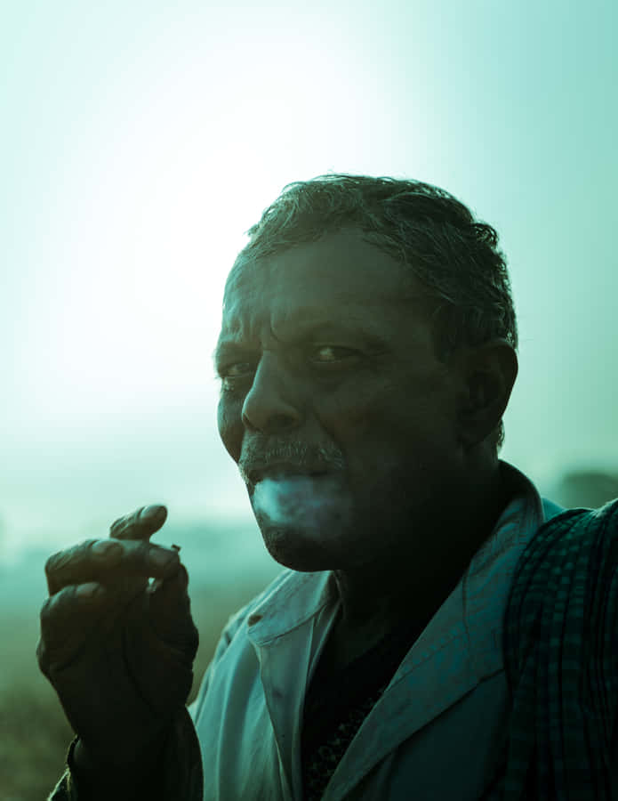 Intimidating Smoking Man Wallpaper