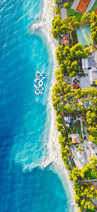 Iphone 16 Plus Aerial Beach Shot Wallpaper