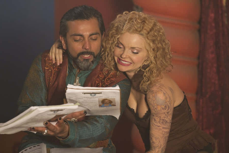 Izabella Miko Posing Effortlessly In Front Of A Beautiful Beach Backdrop. Wallpaper