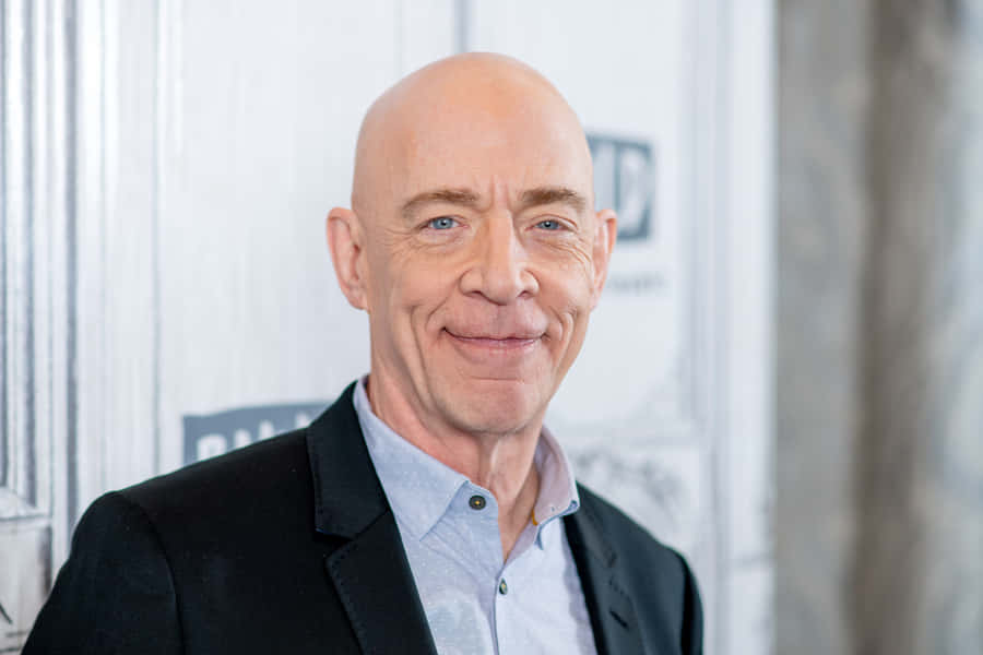 J.k. Simmons Posing For A Photoshoot Wallpaper