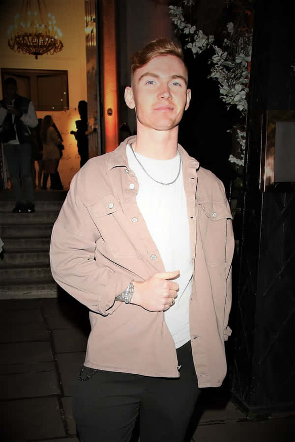 Jack Keating Confidently Posing In An Urban Location Wallpaper