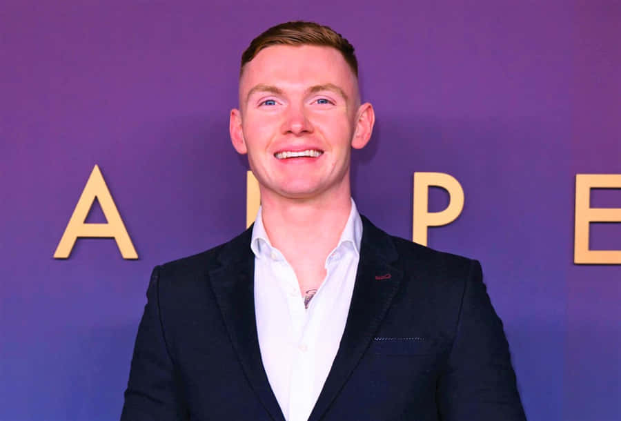 Jack Keating Exploring The Vibrant Cityscape Wallpaper