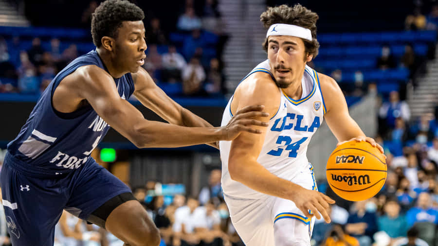 Jaime Jaquez Jr. In Action During A Professional Basketball Game Wallpaper